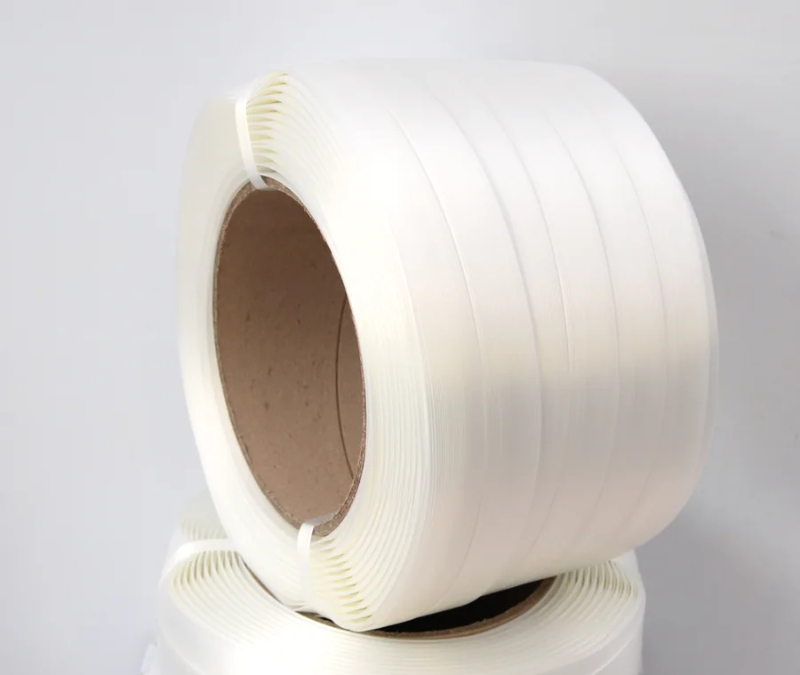 White composite cord strapping rolls wound on cardboard cores.